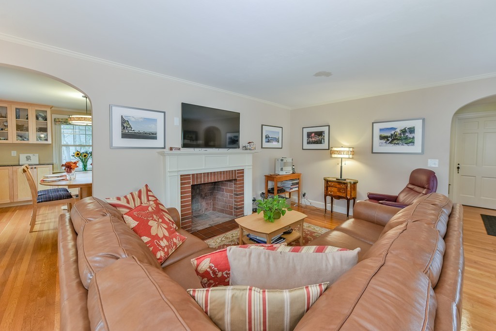 74 Puritan Road Newton, MA 02468 - Photo 3 of 25 a living room with furniture fireplace and a flat screen tv
