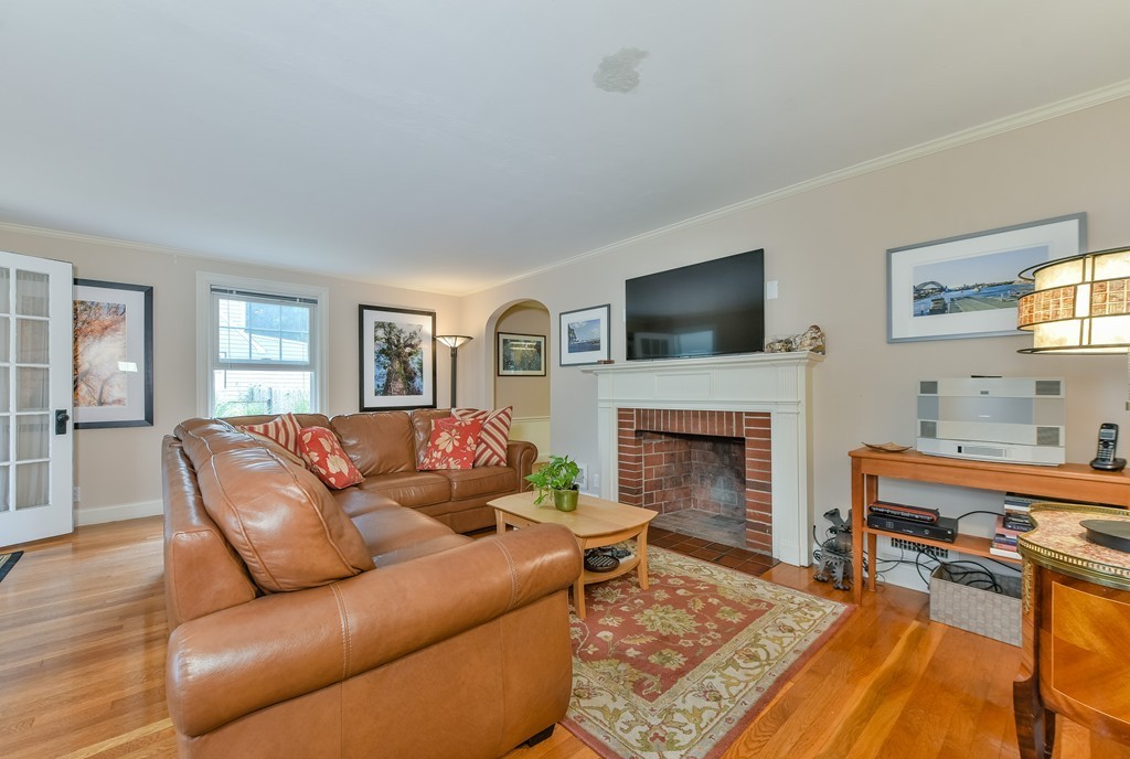 74 Puritan Road Newton, MA 02468 - Photo 4 of 25 a living room with furniture fireplace and flat screen tv