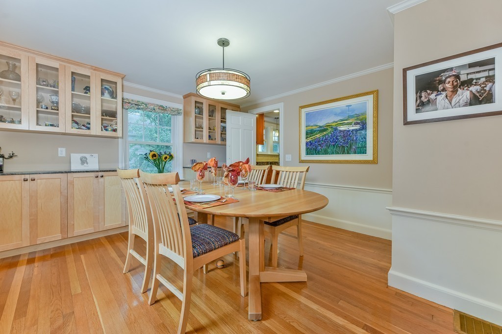 74 Puritan Road Newton, MA 02468 - Photo 6 of 25 a view of a dining room with furniture wooden floor and chandelier