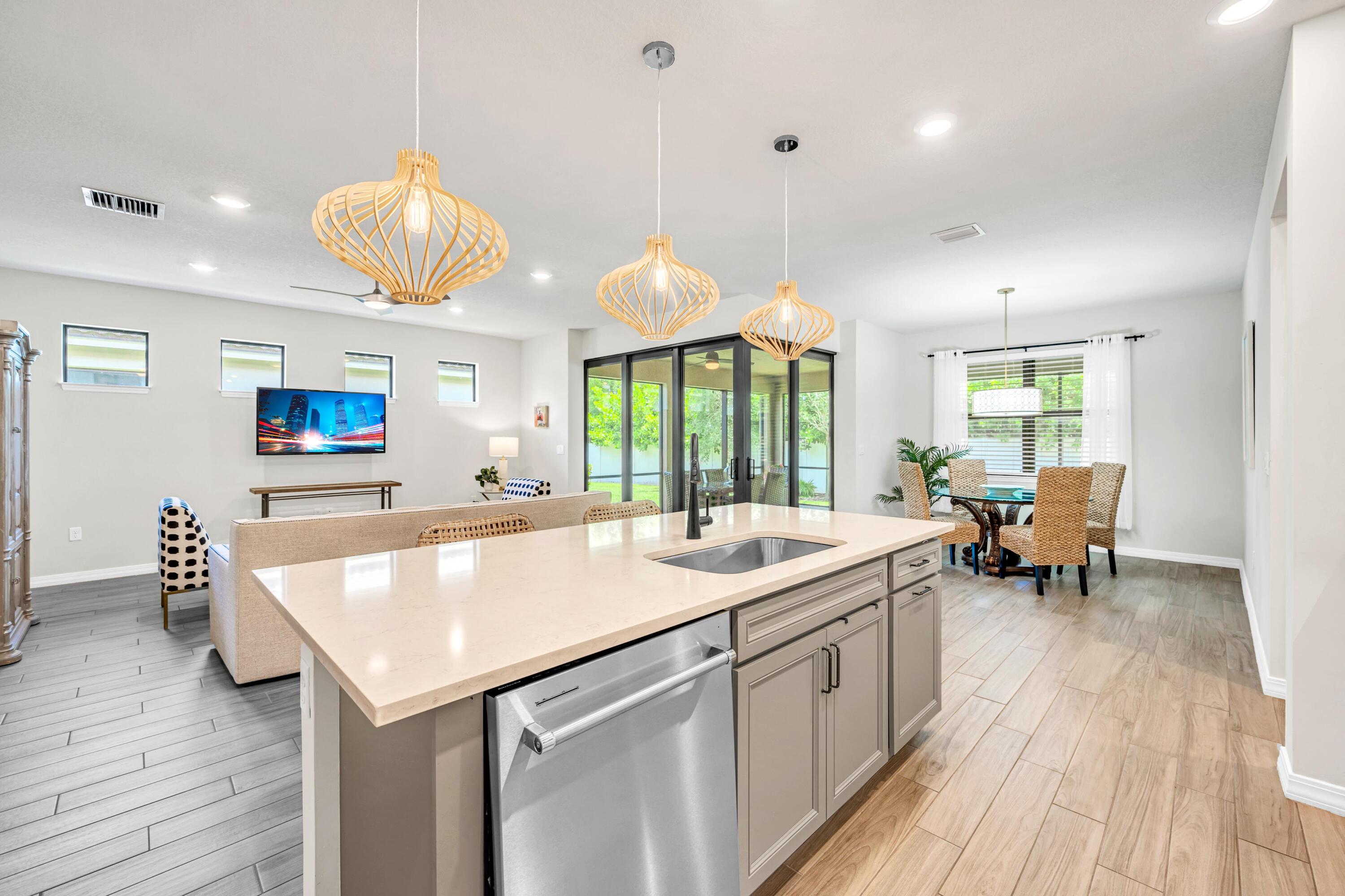 8028 Northwest 78th Street Tamarac, FL 33321 - Photo 27 of 38 a large kitchen with a table and chairs