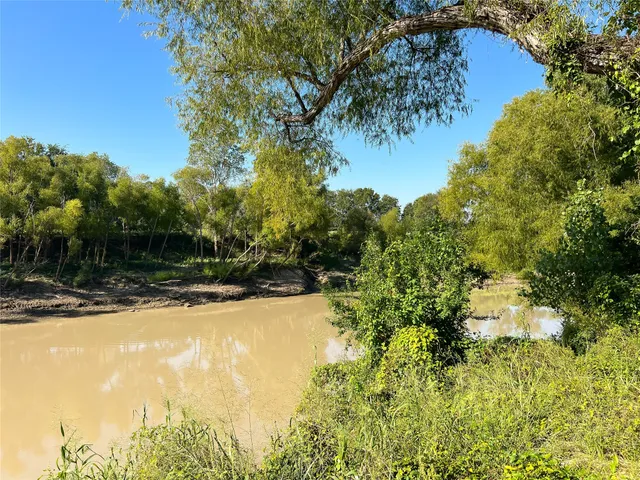 a view of a backyard of the house