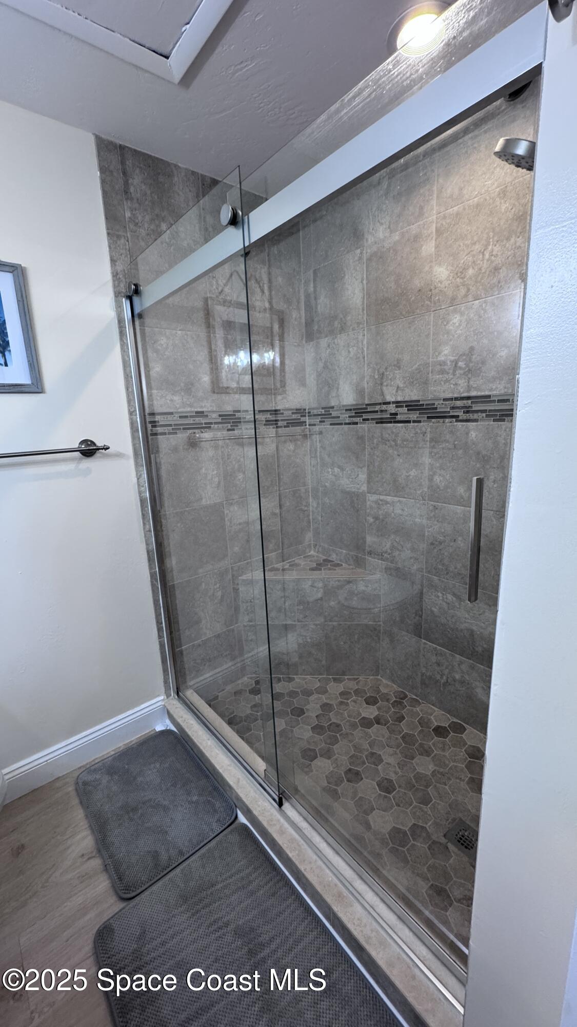 1841 Island Club Drive, Unit 472 Indialantic, FL 32903 - Photo 16 of 23 a bathroom with a glass shower door
