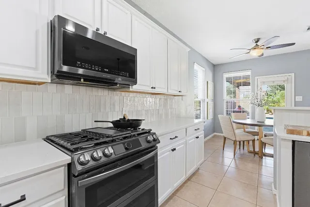 a kitchen with a stove and a microwave