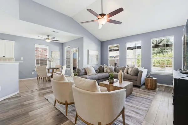 a living room with furniture and a large window