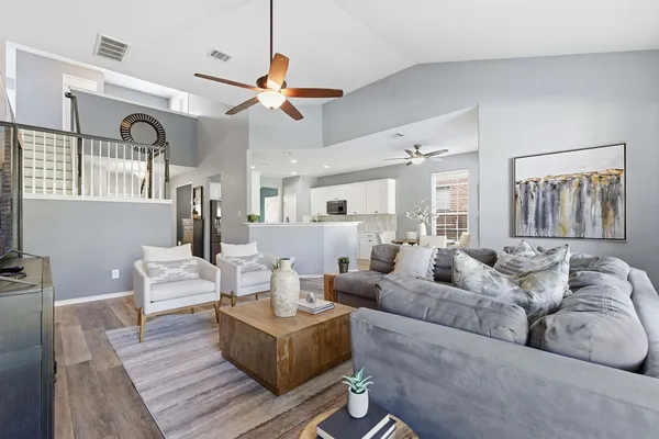 a living room with furniture and a large window
