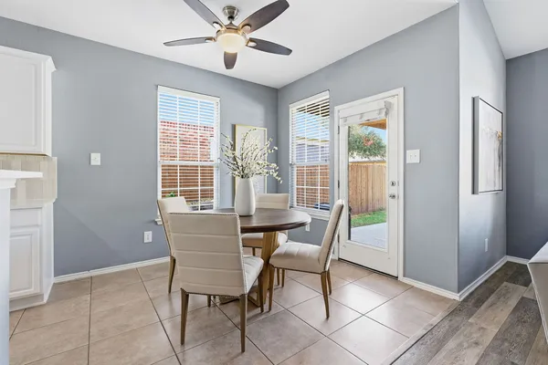 a dining room with furniture and window
