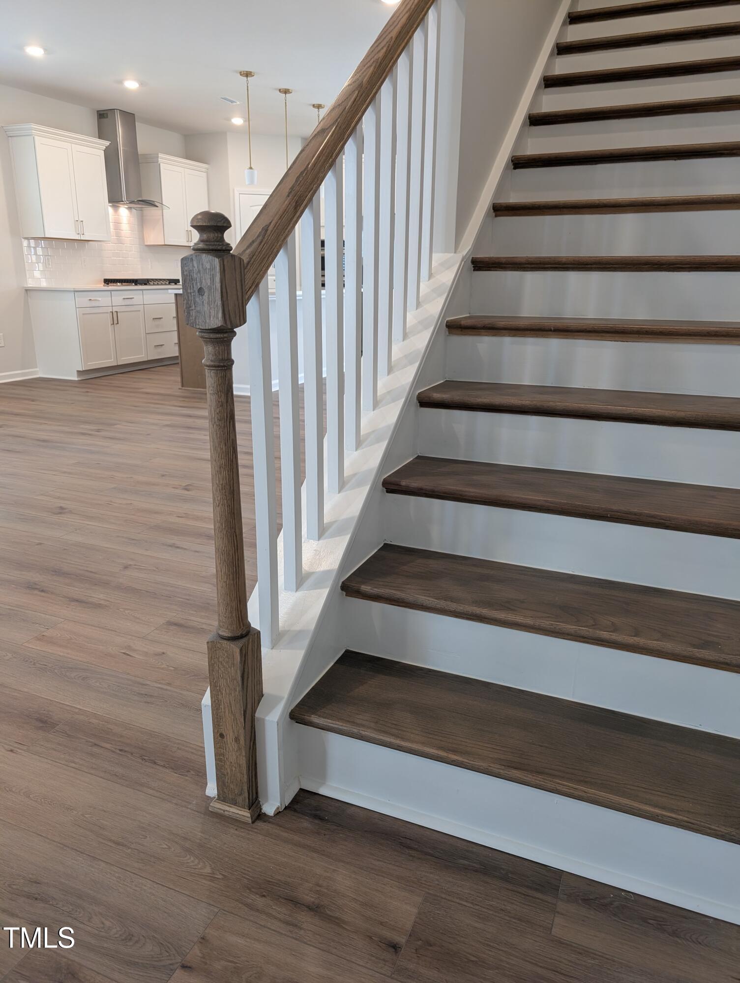 9224 Leaning Post Road, Unit 445 Wake Forest, NC 27587 - Photo 15 of 28 Hardwood Stair Treads w/Open Rail