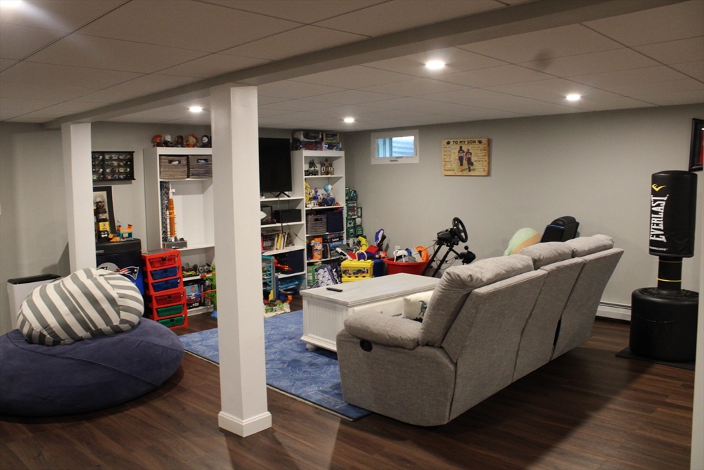 225 Braemoor Road Brockton, MA 02301 - Photo 28 of 29 a living room with furniture and a wooden floor