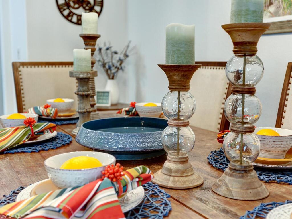 783 92nd Avenue North Naples, FL 34108 - Photo 12 of 32 a dining room with furniture and wooden floor