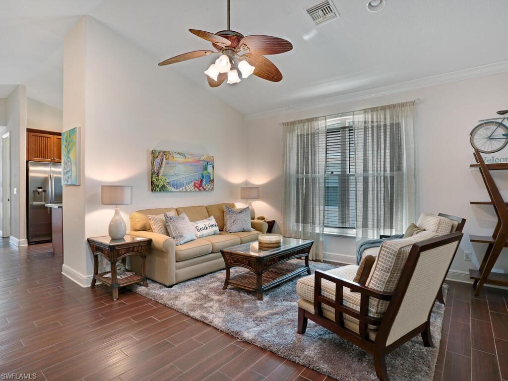 783 92nd Avenue North Naples, FL 34108 - Photo 13 of 32 a living room with furniture and a large window