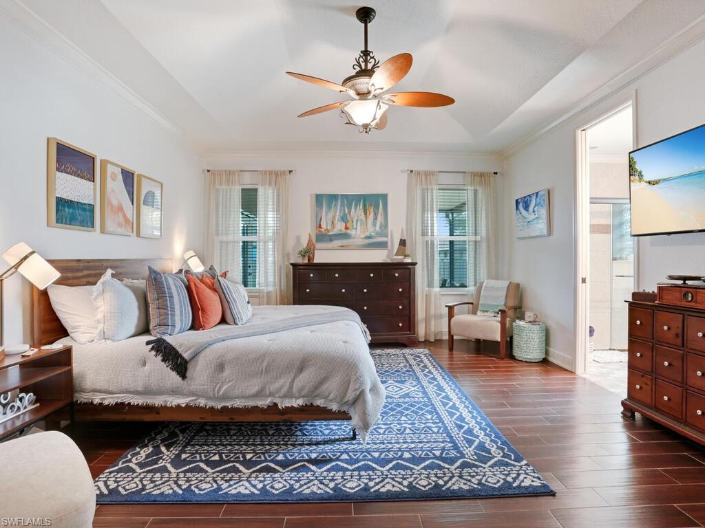 783 92nd Avenue North Naples, FL 34108 - Photo 20 of 32 a living room with furniture and a wooden floor