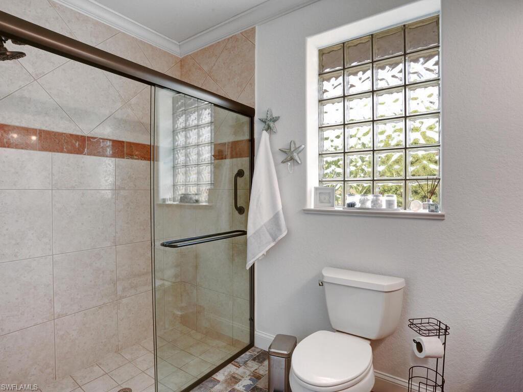 783 92nd Avenue North Naples, FL 34108 - Photo 26 of 32 a bathroom with a toilet and a shower