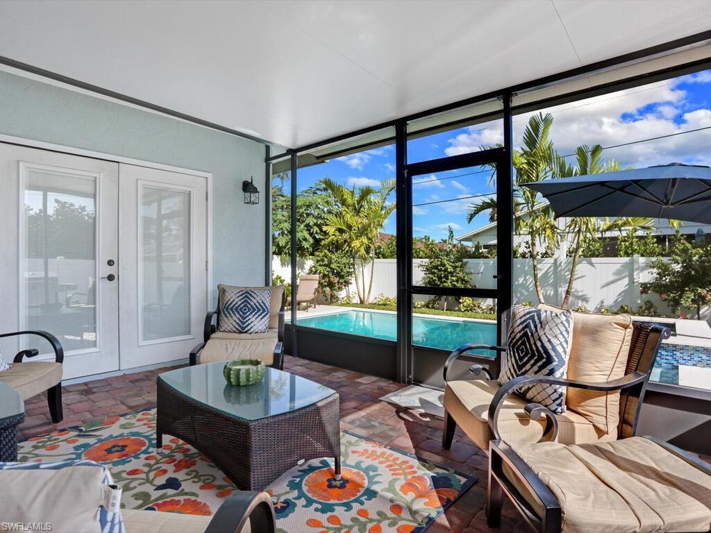 783 92nd Avenue North Naples, FL 34108 - Photo 3 of 32 a living room with furniture and a large window
