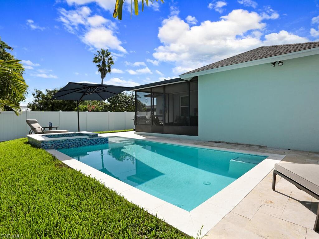 783 92nd Avenue North Naples, FL 34108 - Photo 32 of 32 a view of a backyard with a tub and chairs