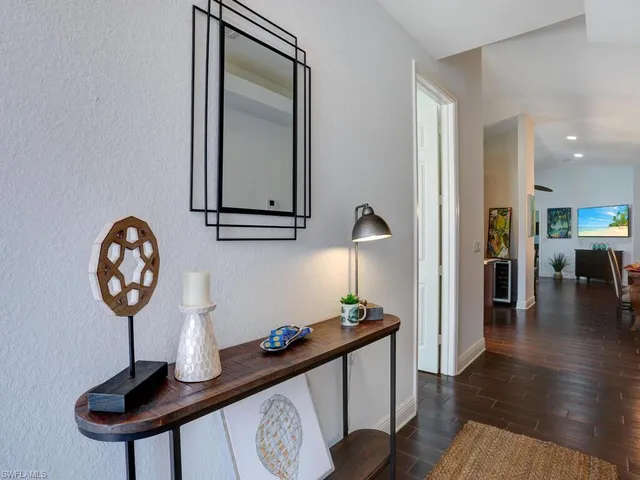 a view of a hallway with seating area