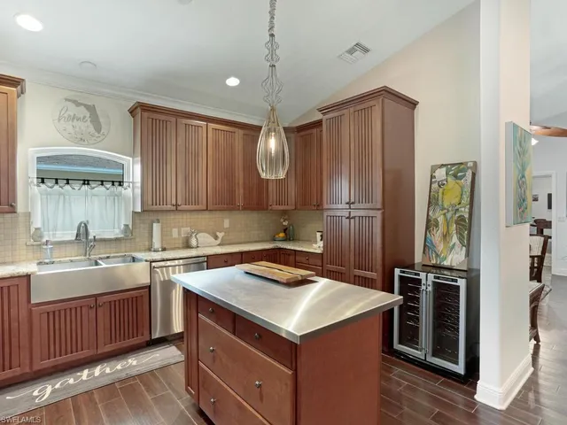 a kitchen with a sink stove and refrigerator