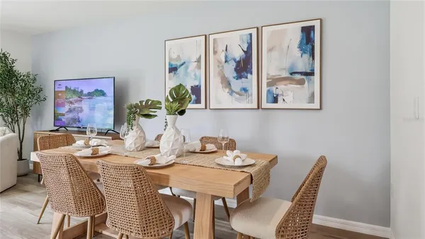 a dining room with furniture and wooden floor