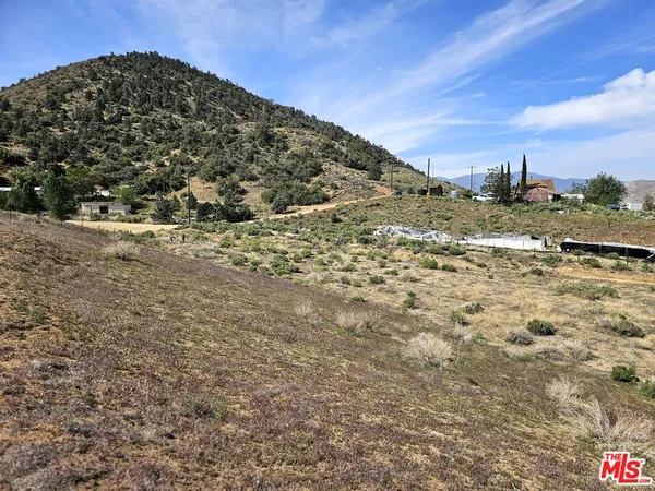 a view of a large building with a yard