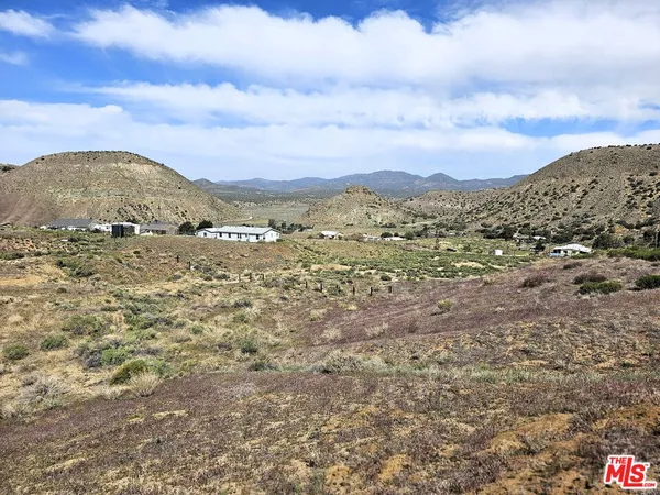 a view of mountain view with mountains in the background