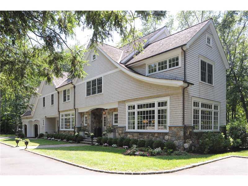 76 Hanson Road Darien, CT 06820 - Photo 1 of 25 a view of a white house with large windows and plants