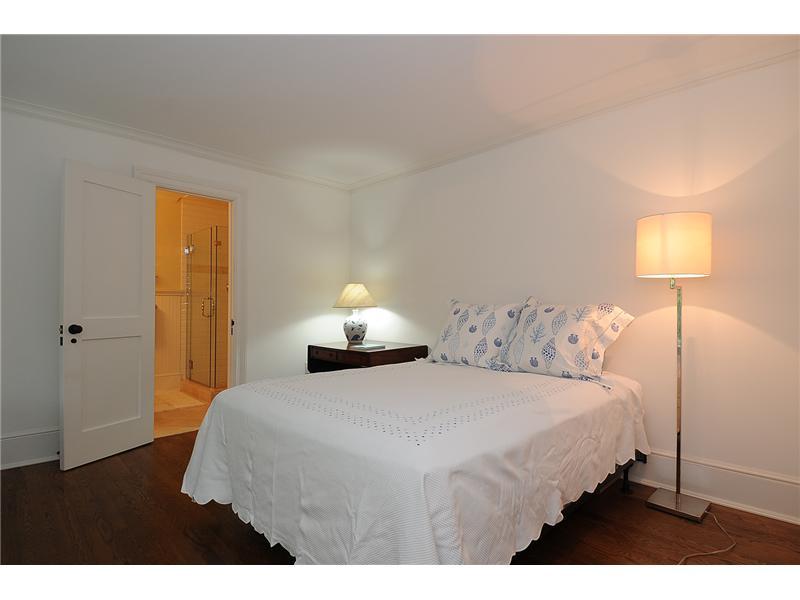 76 Hanson Road Darien, CT 06820 - Photo 20 of 25 a bedroom with a bed and a lamp