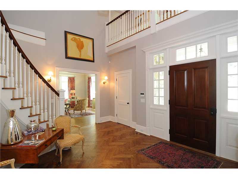 76 Hanson Road Darien, CT 06820 - Photo 2 of 25 a view of a hallway with wooden floor and stairs