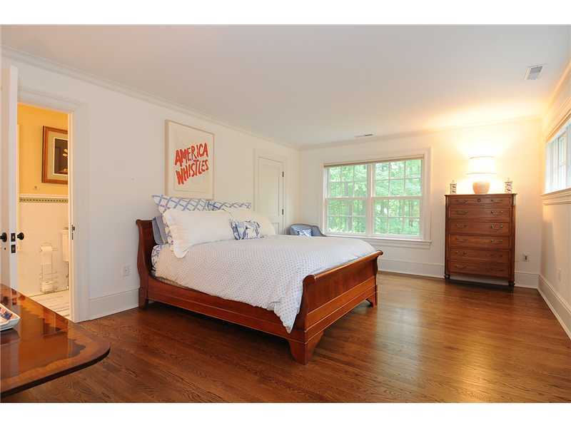 76 Hanson Road Darien, CT 06820 - Photo 21 of 25 a spacious bedroom with a bed and a dresser