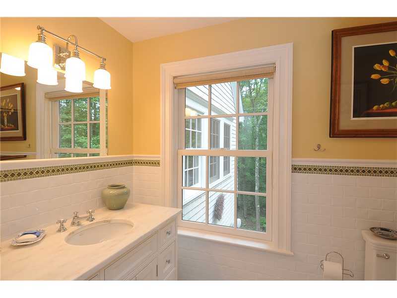 76 Hanson Road Darien, CT 06820 - Photo 22 of 25 a bathroom with a sink mirror and a bathtub