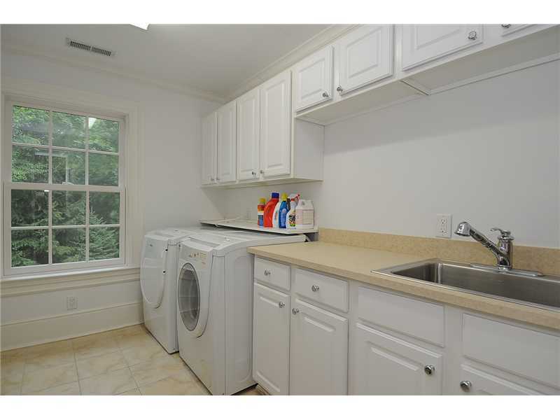 76 Hanson Road Darien, CT 06820 - Photo 23 of 25 a kitchen with a sink cabinets and a window