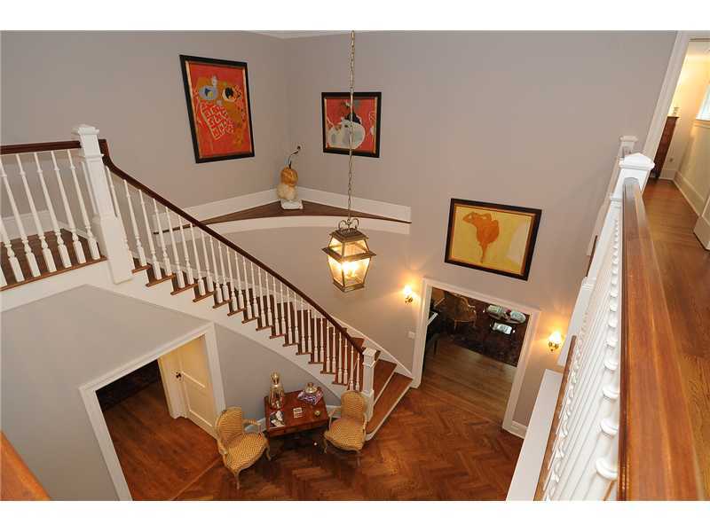 76 Hanson Road Darien, CT 06820 - Photo 3 of 25 a view of a hallway with wooden floor and stairs