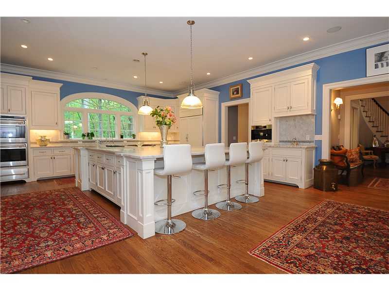 76 Hanson Road Darien, CT 06820 - Photo 8 of 25 a kitchen with stainless steel appliances granite countertop a sink stove and wooden cabinets