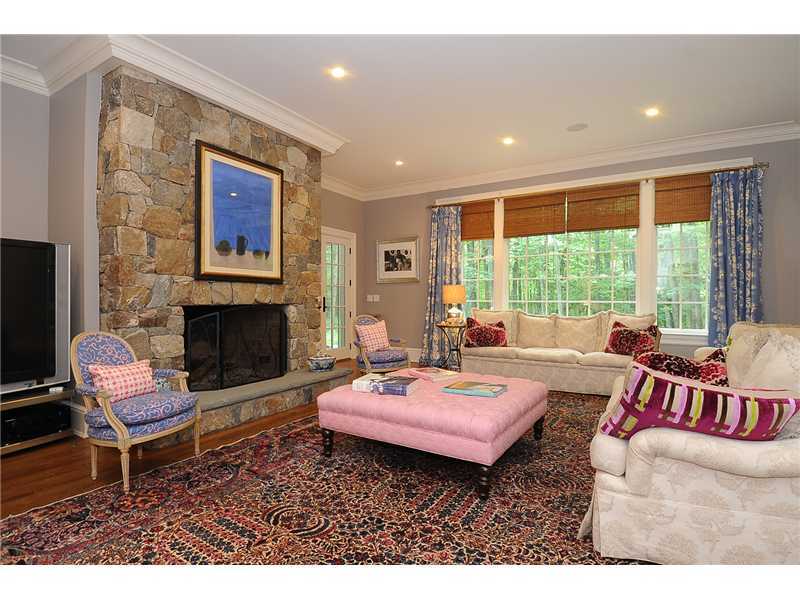 76 Hanson Road Darien, CT 06820 - Photo 10 of 25 a living room with furniture and a fireplace
