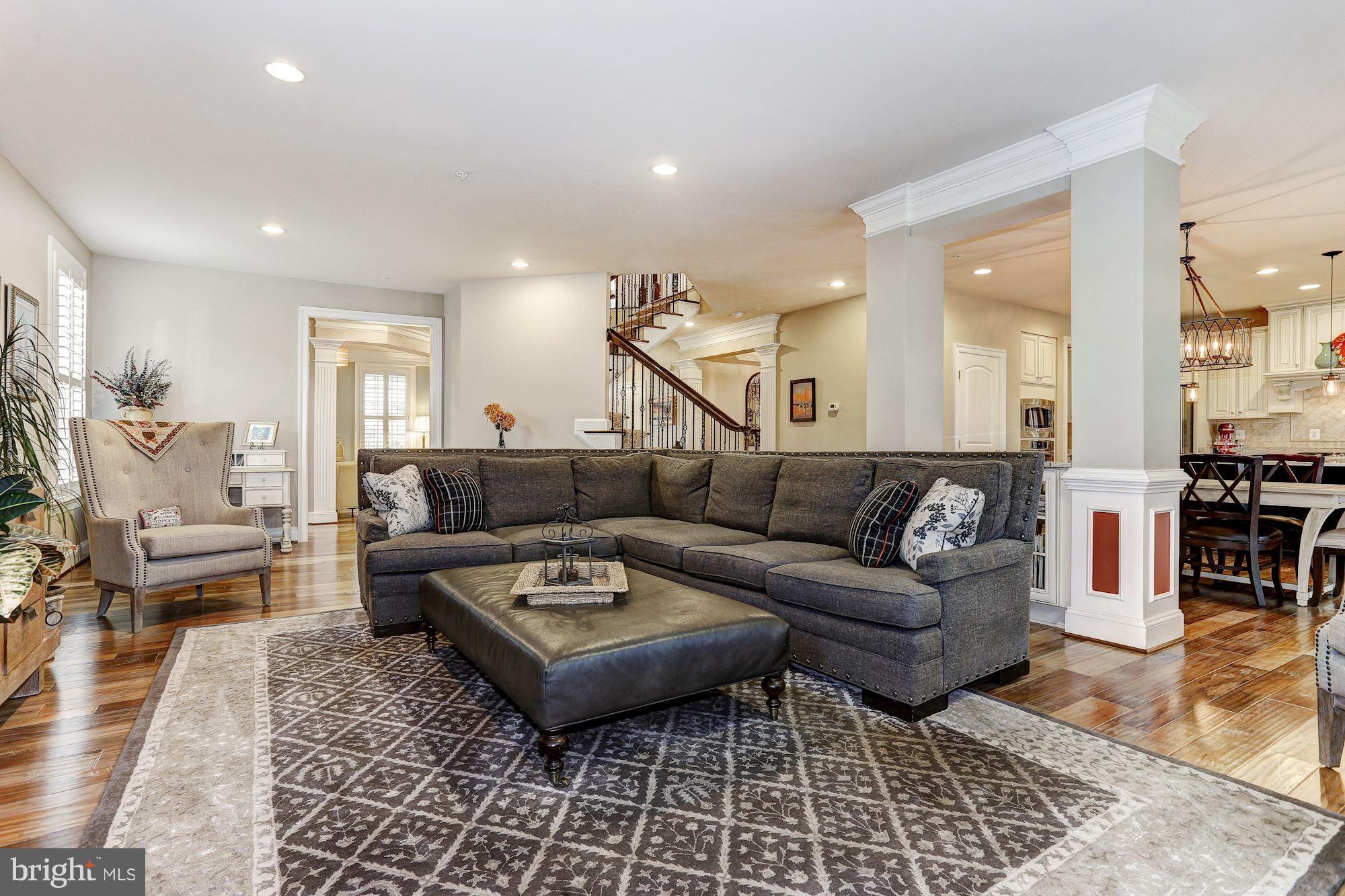 7806 Blue Ribbon Street Fulton, MD 20759 - Photo 11 of 30 a living room with furniture and wooden floor