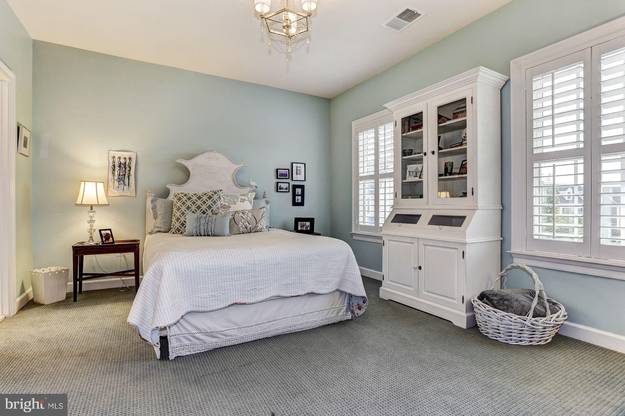 7806 Blue Ribbon Street Fulton, MD 20759 - Photo 17 of 30 a bedroom with a bed and a window