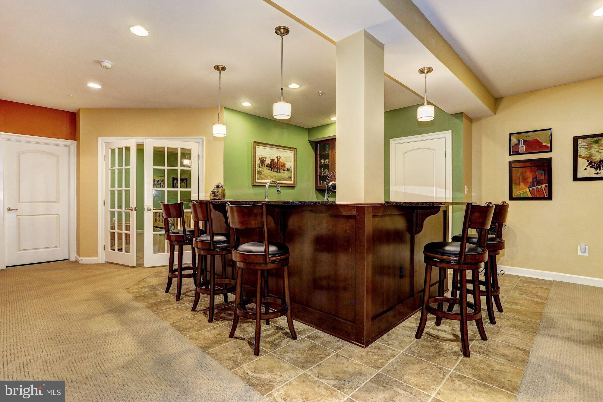 7806 Blue Ribbon Street Fulton, MD 20759 - Photo 20 of 30 a view of a a dining room with furniture and chandelier