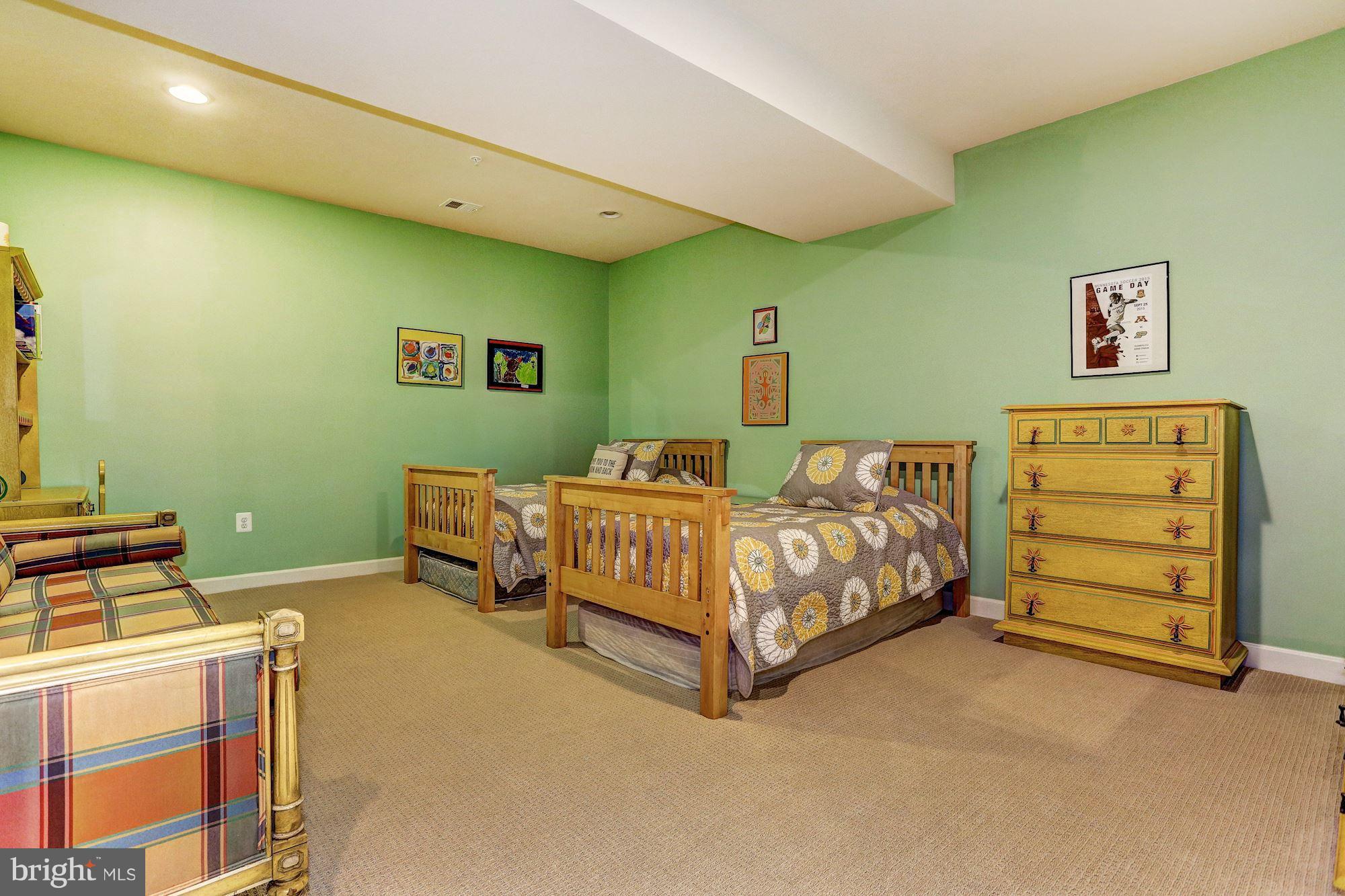 7806 Blue Ribbon Street Fulton, MD 20759 - Photo 23 of 30 a bedroom with a bed and a dresser