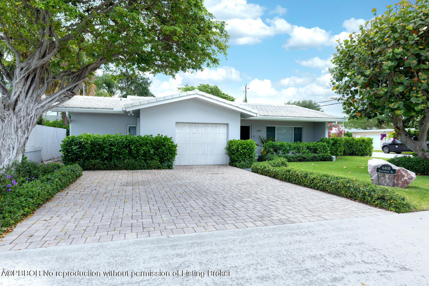6408 Washington Road West Palm Beach, FL 33405 - Photo 2 of 19 a front view of a house with a yard