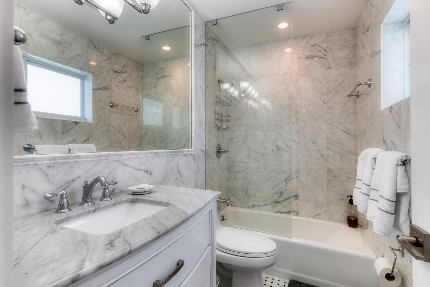 6408 Washington Road West Palm Beach, FL 33405 - Photo 11 of 19 a bathroom with a granite countertop sink a toilet and shower