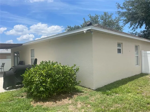 a backyard of a house with lots of green space