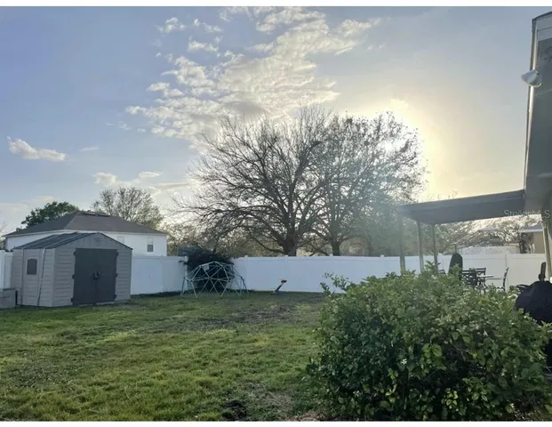 a backyard of a house with lots of green space