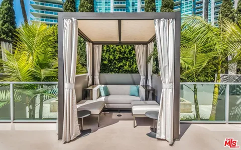 a outdoor living space with furniture and garden view