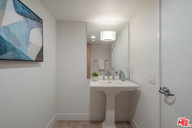 a bathroom with a sink and mirror