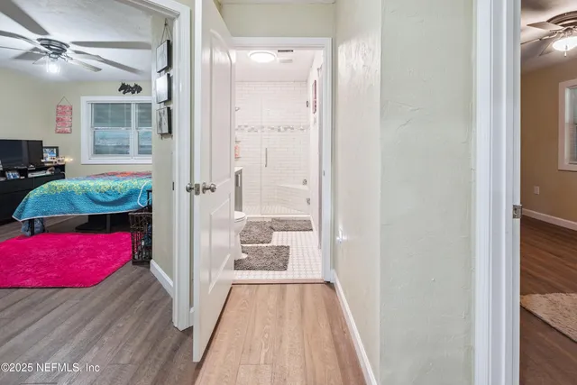 a bathroom with a sink a mirror and shower