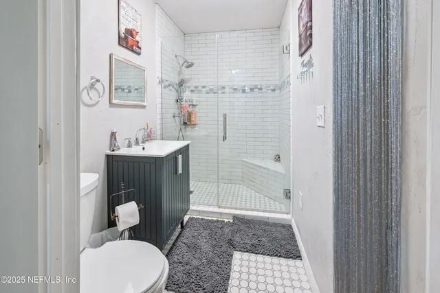 a spacious bedroom with a bed and a window