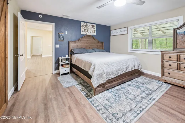 a bedroom with a bed and a dresser