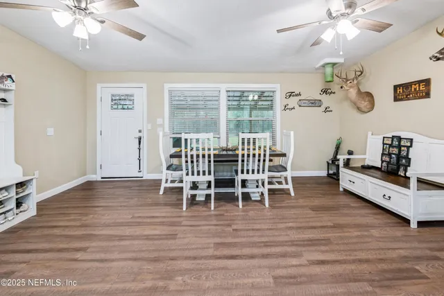 a view of a dining room with furniture window and wooden floor
