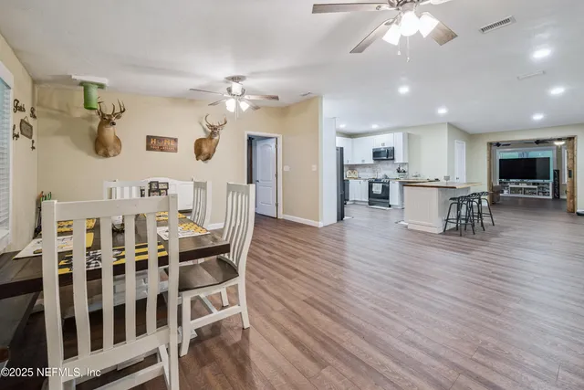 a kitchen with a refrigerator a sink and a stove
