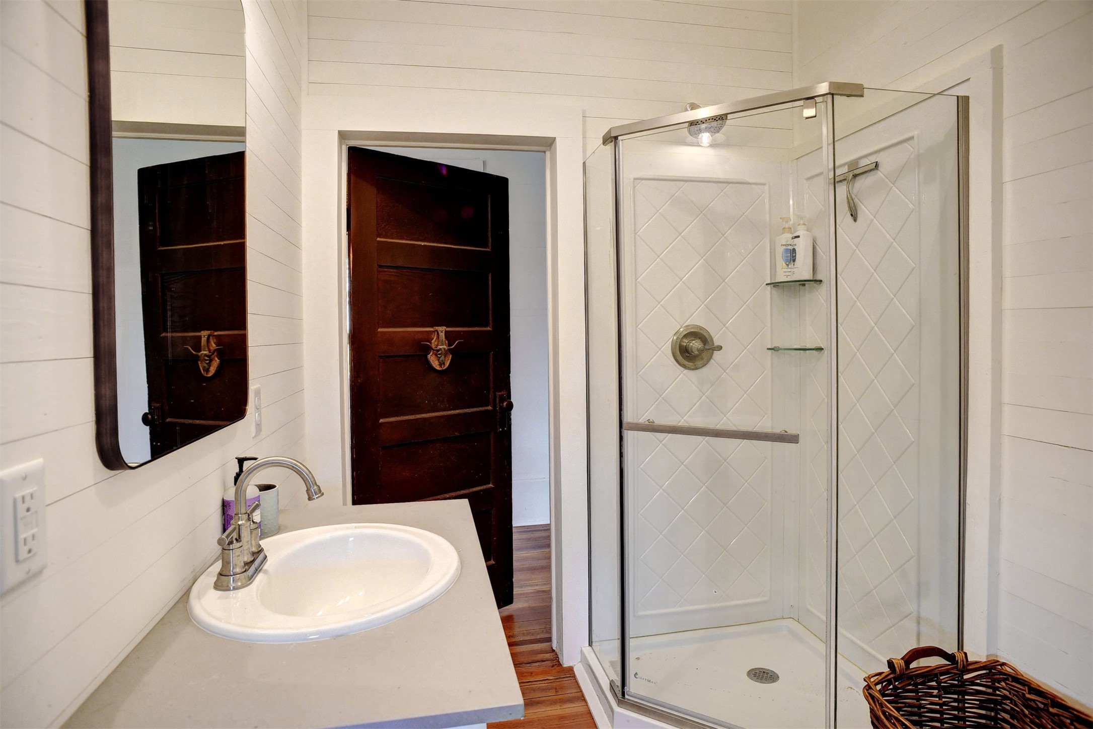 141 Grassyville Road Paige, TX 78659 - Photo 14 of 34 a bathroom with a shower sink and mirror