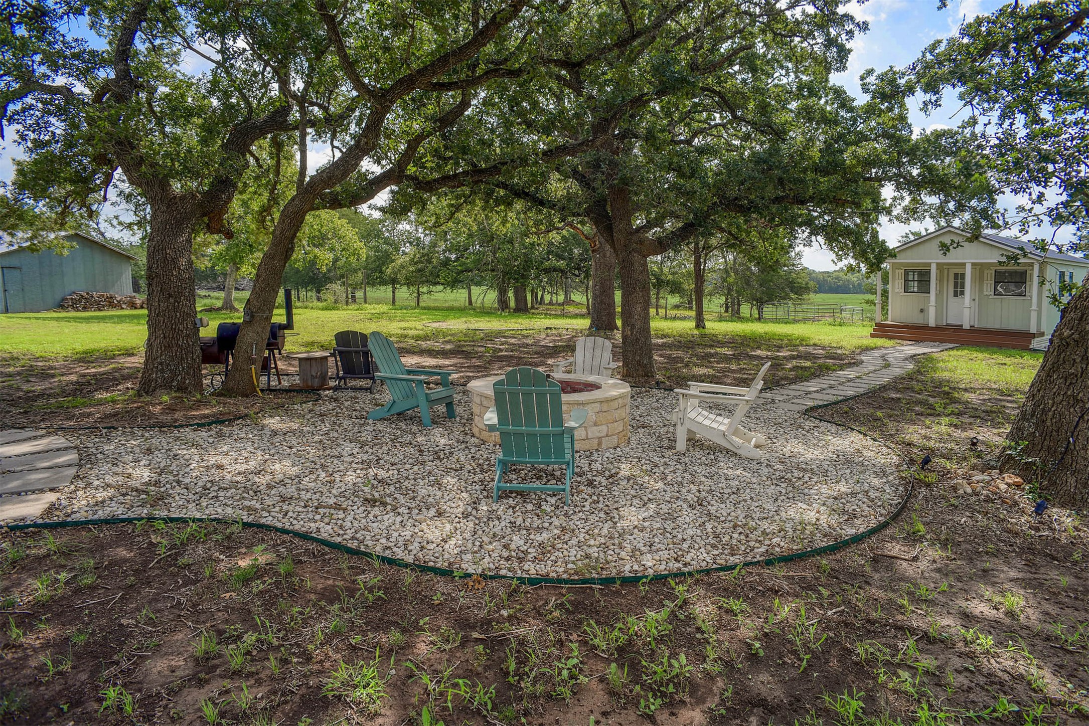 141 Grassyville Road Paige, TX 78659 - Photo 17 of 34 a view of a backyard with tree s