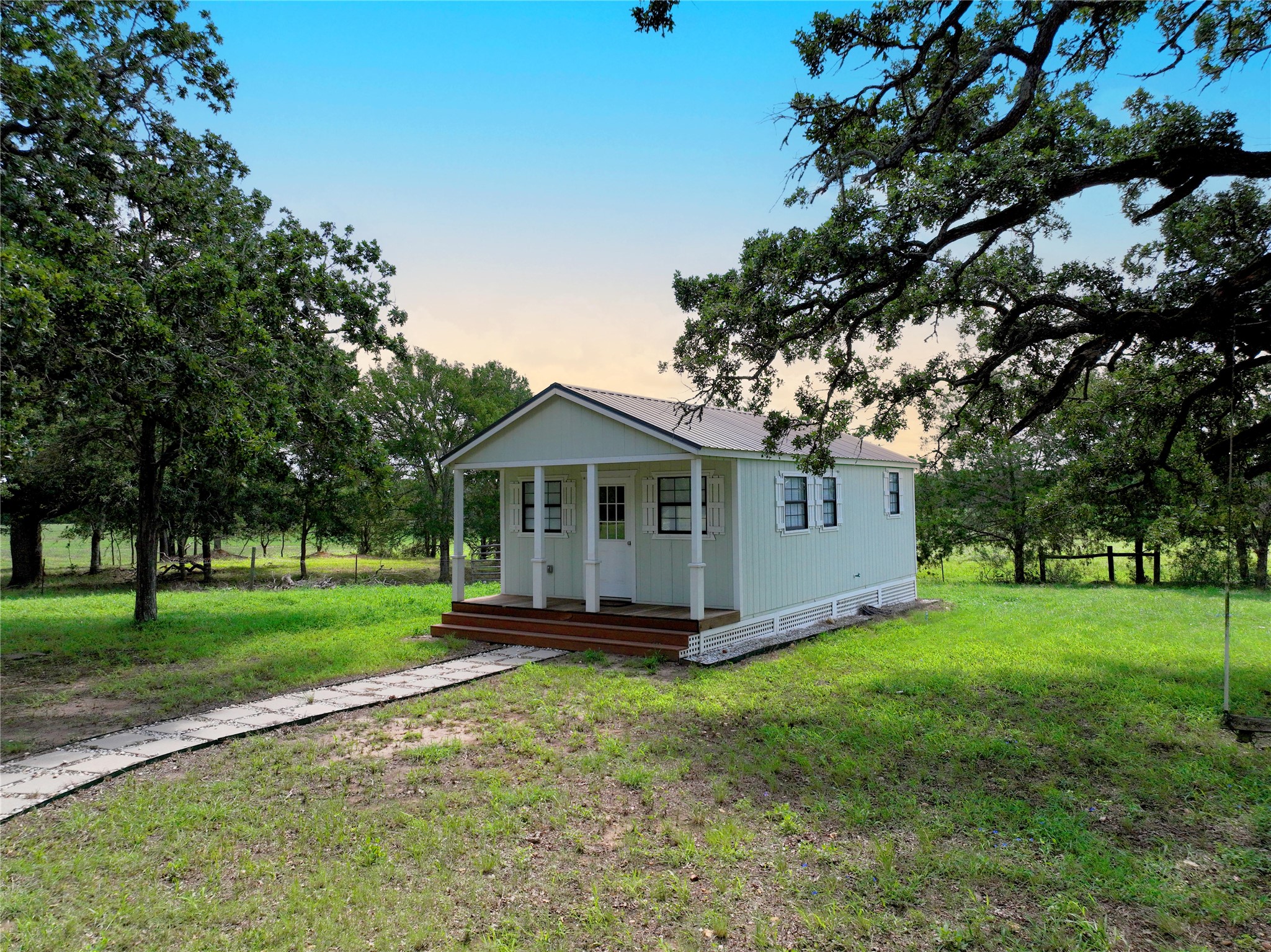 141 Grassyville Road Paige, TX 78659 - Photo 18 of 34 a front view of a house with a yard